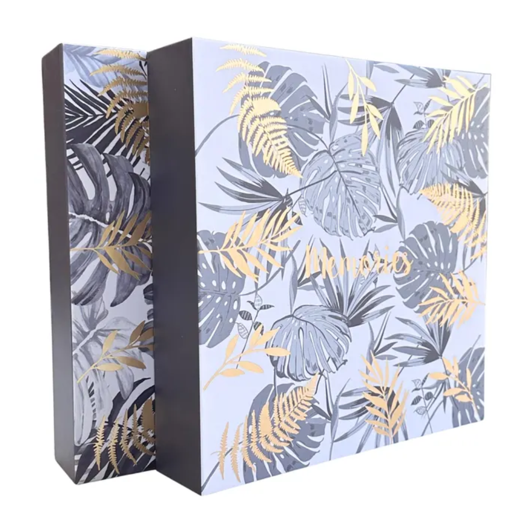 photo album with tropical leaf pattern on a white background