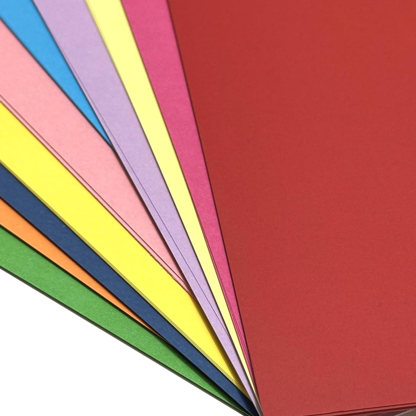 Colorful paper sheets arranged in a fan-like pattern on a white background