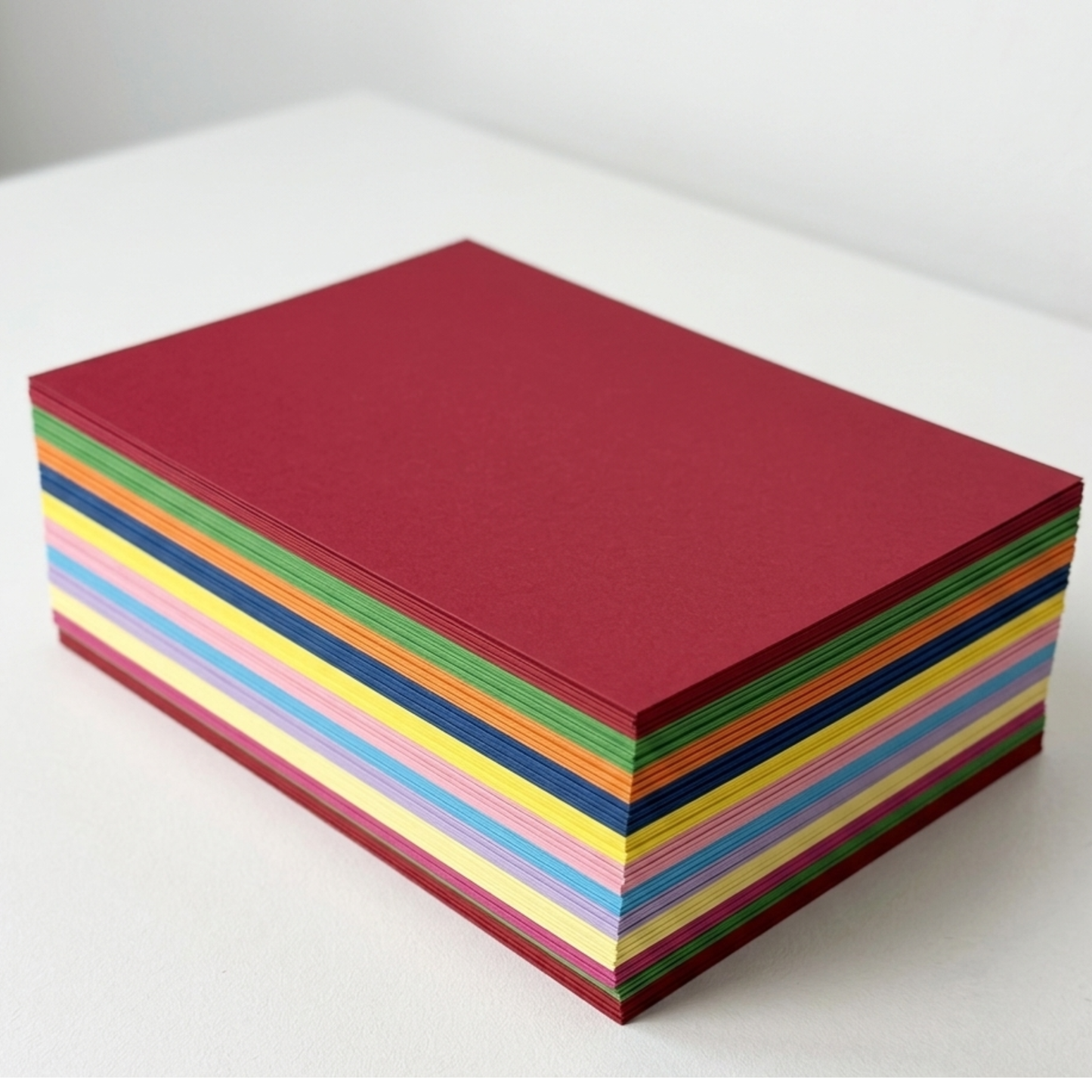 Stack of colorful paper sheets on a white background