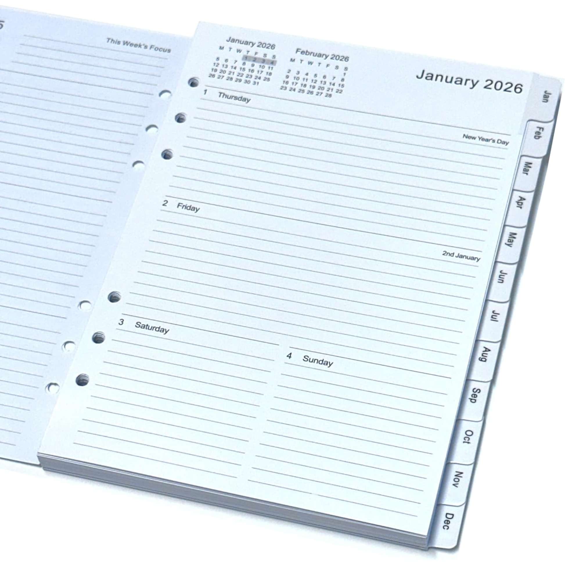 An open spiral-bound planner or calendar organizer showing January 2026, with lined daily sections, a small monthly calendar at the top, and MONTH page tabs along the right edge.