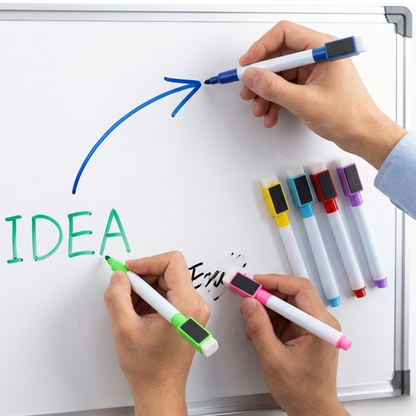Hands writing 'IDEA' on a whiteboard with colorful markers.