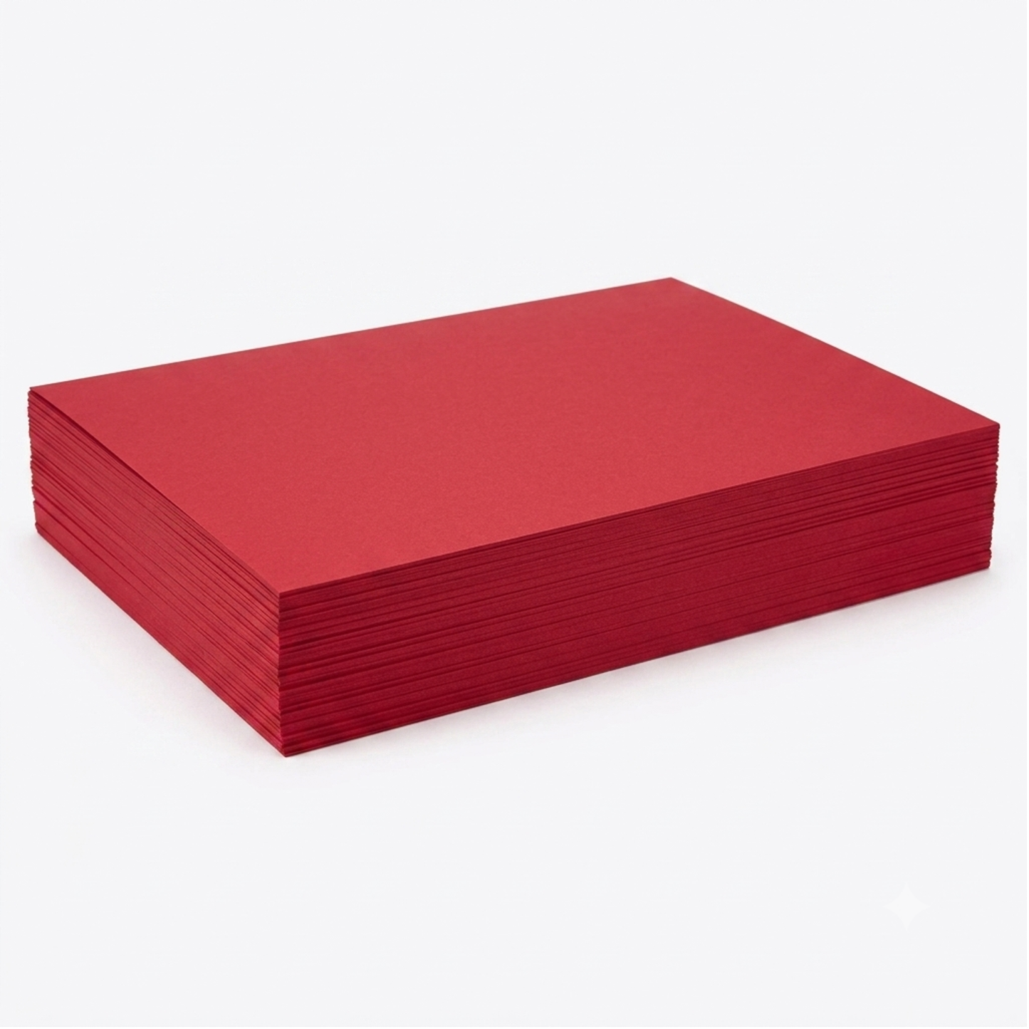A stack of red rectangular sheets or cards, photographed at an angle on a clean white background.