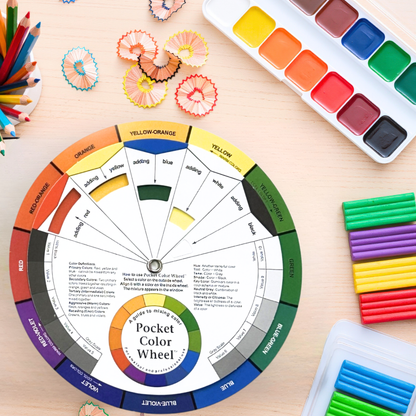 large Colour wheel with art supplies on a wooden surface