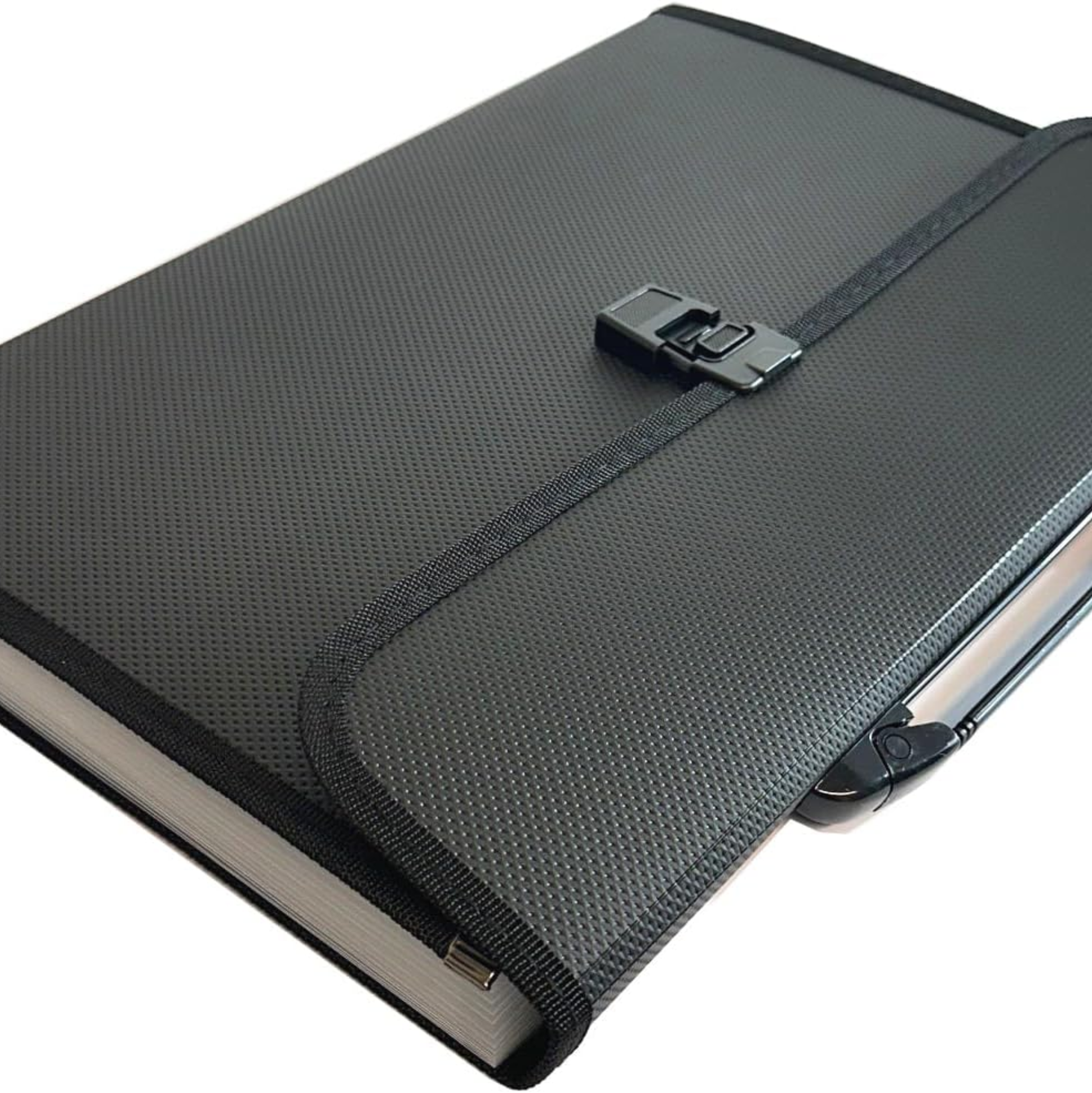 A black textured hardcover notebook or journal with a black elastic closure strap and metal clasp, shown on a plain white background.